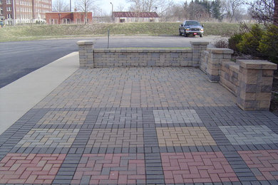Patio - small transitional front yard brick patio idea in Tampa with no cover