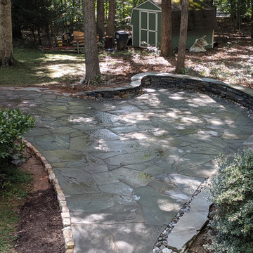 Large Irregular Bluestone Patio, Seating Wall, and Walkways Plus In Laid Design