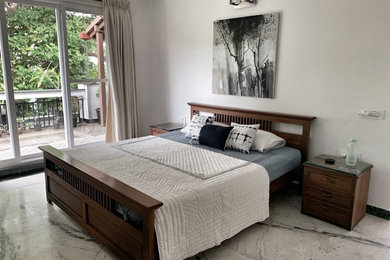 Example of a trendy bedroom design in Bengaluru