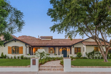 Example of a transitional exterior home design in Phoenix