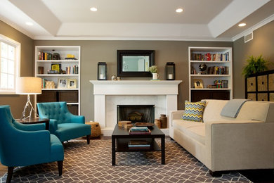 Example of a trendy living room design in Los Angeles with beige walls, a standard fireplace and a stone fireplace