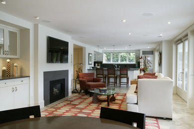 Photo of a mid-sized modern formal open concept living room in Portland with white walls, concrete floors, a standard fireplace, a stone fireplace surround and a wall-mounted tv.
