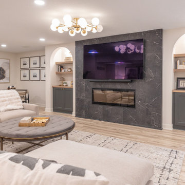 Warm & Inviting Basement Retreat with Custom Bar + Entertainment Center