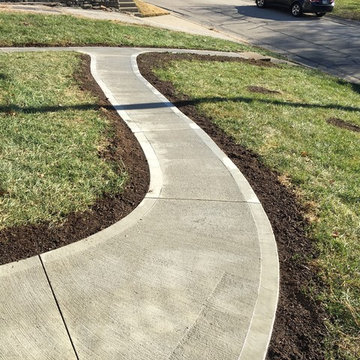 Front porch with concrete walkway to boost home sale.