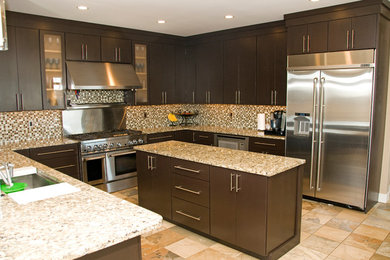 Large minimalist u-shaped open concept kitchen photo in Cedar Rapids with an undermount sink, flat-panel cabinets, dark wood cabinets, granite countertops, mosaic tile backsplash, stainless steel appliances and two islands