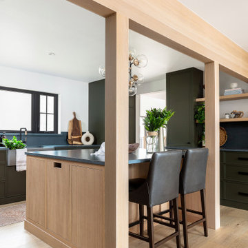 U-Shaped Cottage Kitchen with Green Flat Panel Cabinets and Oak Accents