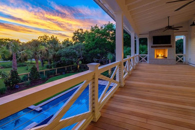 This is an example of a coastal porch design in Charleston.