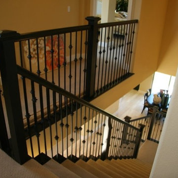 Black painted stair with metal balustrade