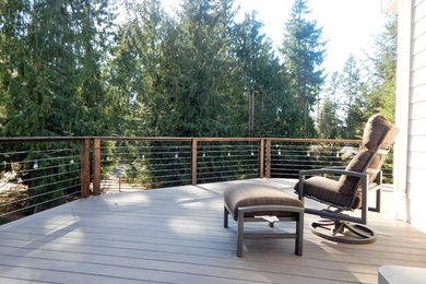 Inspiration for a rustic backyard deck remodel in Seattle with no cover