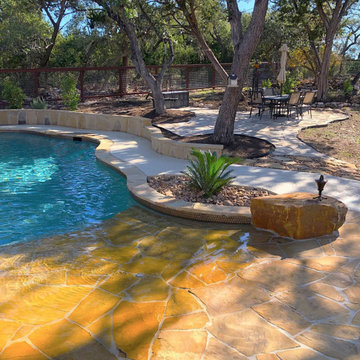 Freeform with Grotto, Beach Entry, and Flagstone Sun Shelf