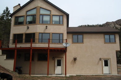 Large craftsman beige two-story mixed siding exterior home idea in Denver with a shingle roof