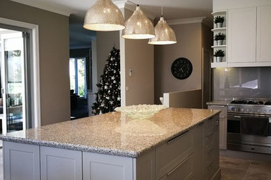Traditional kitchen in Melbourne with shaker cabinets, grey cabinets and with island.