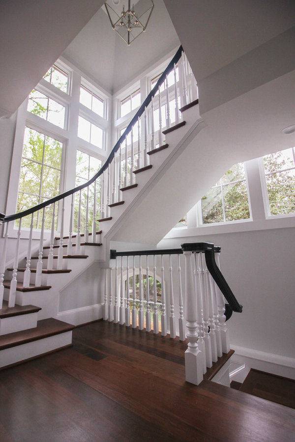 Powerful Impression by Floating Staircase in Suburban Foyer