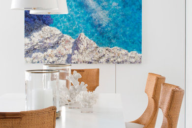 Inspiration for a mid-sized beach style dining room in New York with white walls and white floor.