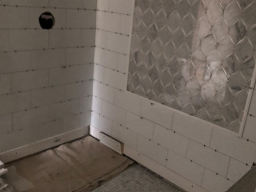Should I seal my marble shower floor and walls myself before grout??
