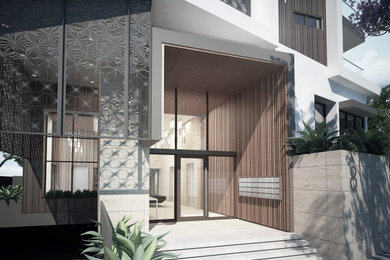 Photo of a mid-sized contemporary apartment exterior in Perth with four or more storeys.