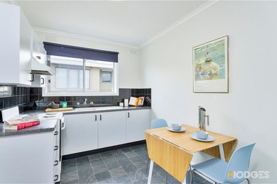 Example of a trendy kitchen design in Melbourne