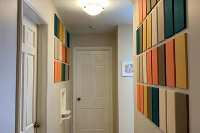Hallway - small mid-century modern light wood floor and beige floor hallway idea in Denver with gray walls