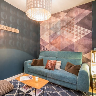 Example of a small trendy enclosed light wood floor home theater design in Angers with multicolored walls and a wall-mounted tv