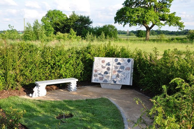 Large classic back formal partial sun garden for summer in West Midlands with a garden path and natural stone paving.