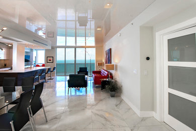 Mid-sized trendy formal and open concept marble floor and gray floor living room photo in Miami with gray walls, no fireplace and no tv