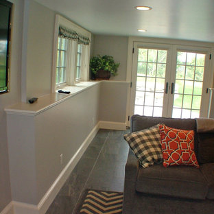 Medium sized classic enclosed home cinema in Portland Maine with slate flooring and a wall mounted tv.