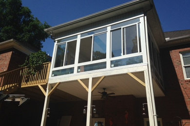 Example of a sunroom design in Other