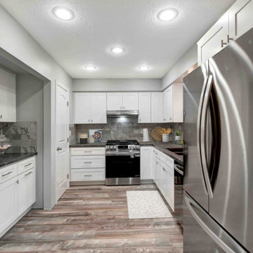 Crisp Contrast: Huntington Beach Kitchen with White Cabinets & Dark Counters