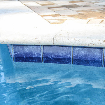 AFTER WITH PAVERS PUT IN:  Pool with firepit, english garden, large patio areas