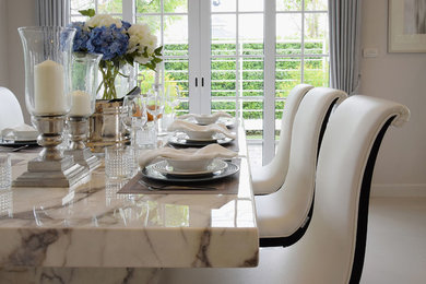 Mid-sized transitional carpeted and beige floor enclosed dining room photo in Houston with gray walls and no fireplace