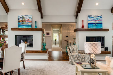 Photo of a large contemporary open concept family room in Other with dark hardwood floors, a standard fireplace, a built-in media wall, a wood fireplace surround and grey walls.