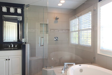 Large master ceramic tile bathroom photo in Raleigh with an undermount sink, white cabinets, granite countertops and blue walls