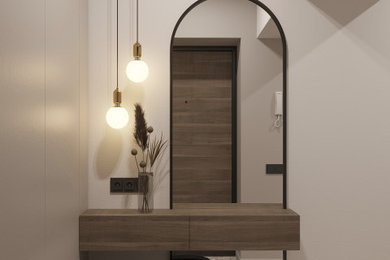 Imagen de hall actual de tamaño medio con paredes beige, suelo de terrazo, puerta simple, puerta de madera en tonos medios y suelo beige