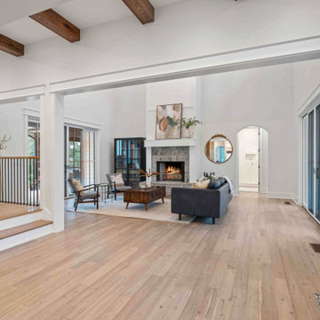 Grand Entryway to Modern Farmhouse: Open-Concept Flow with Exposed Beams and Hil