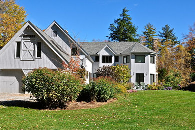Large traditional gray two-story wood exterior home idea in Boston