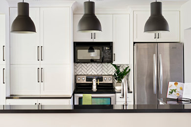 Example of a mid-sized transitional kitchen design in Toronto
