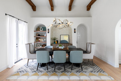 Mid-sized eclectic light wood floor great room photo in San Diego with white walls
