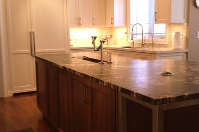 Inspiration for a mid-sized transitional l-shaped dark wood floor eat-in kitchen remodel in Toronto with an undermount sink, white cabinets, marble countertops, white backsplash, white appliances, an island, shaker cabinets and porcelain backsplash
