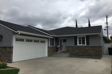 Inspiration for a small transitional gray one-story mixed siding exterior home remodel in Los Angeles with a shingle roof