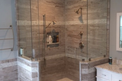 Inspiration for a mid-sized transitional master bathroom in DC Metro with grey walls, recessed-panel cabinets, white cabinets, a freestanding tub, a corner shower, an undermount sink, quartzite benchtops, white floor, a hinged shower door and white benchtops.