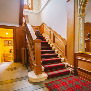 Large traditional carpeted u-shaped staircase in Edinburgh with carpeted risers.