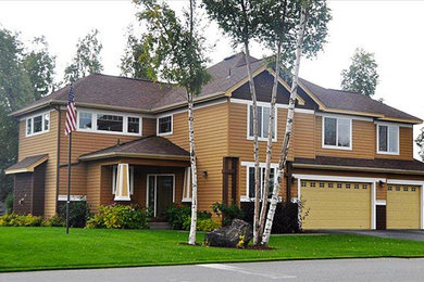 Example of a classic brown exterior home design in Other