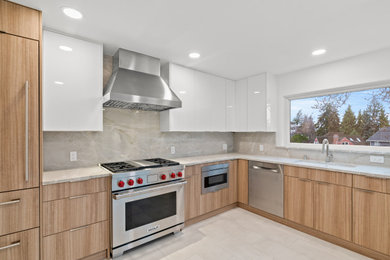 Example of a white floor and wood ceiling kitchen design in Seattle with stainless steel appliances