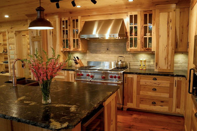 Open concept kitchen - rustic open concept kitchen idea in Toronto with a farmhouse sink, shaker cabinets, light wood cabinets, granite countertops, stainless steel appliances and an island