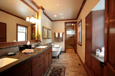 Bathroom - large rustic master bathroom idea in Seattle with shaker cabinets, medium tone wood cabinets, a one-piece toilet, beige walls, an undermount sink and granite countertops