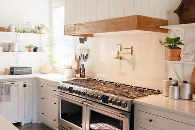 Example of a transitional kitchen design in New Orleans