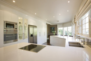 Photo of a mid-sized contemporary u-shaped kitchen in Sydney.
