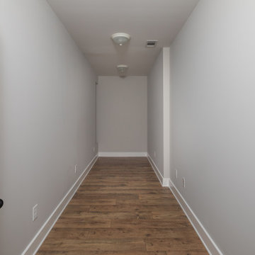 Upstairs Hallway with Hardwood Floors and White Trim