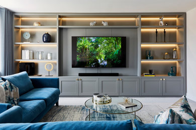 Inspiration for a modern living room in Hertfordshire with a built-in media wall.