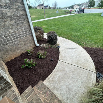 Custom Turf Landscape Area with Stone Border